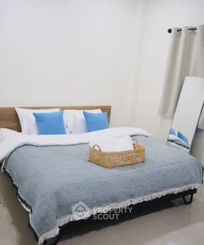 Cozy bedroom with stylish decor and inviting bedding