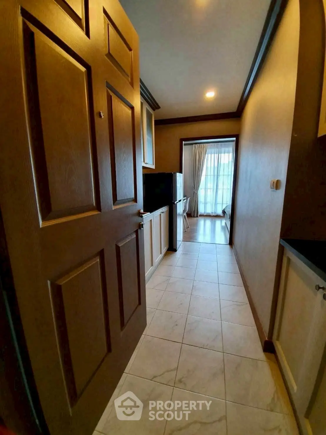 Cozy kitchen with closed layout and modern appliances in a stylish apartment