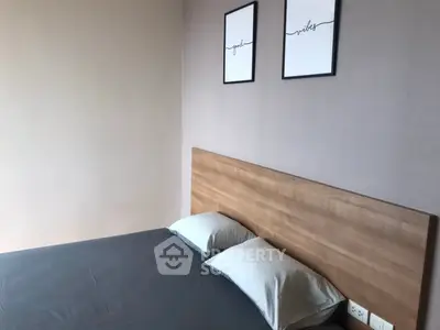 Modern bedroom with minimalist decor and wooden headboard, perfect for a cozy retreat.