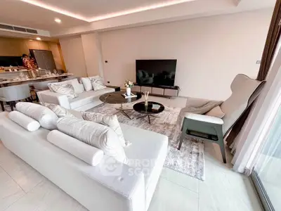 Spacious modern living room with elegant decor and large TV