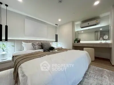 Luxurious modern bedroom with elegant decor and ambient lighting, featuring a cozy bed and stylish furnishings.