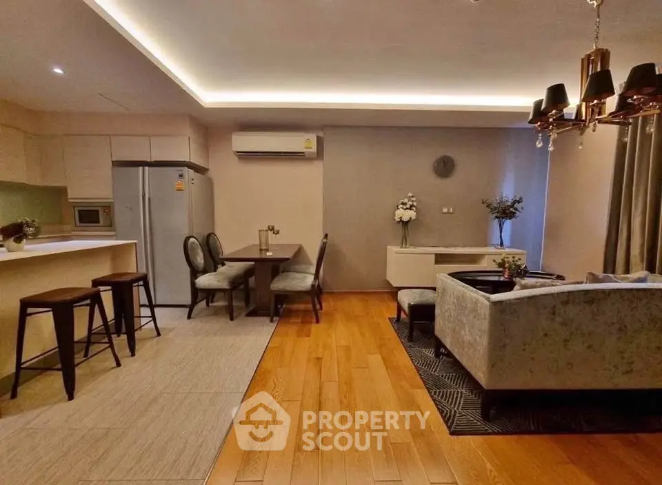Stylish open-plan living room with modern kitchen and elegant decor