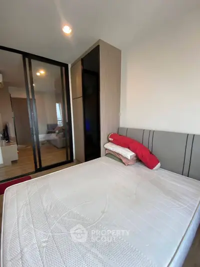 Modern bedroom with sliding glass doors and minimalistic design