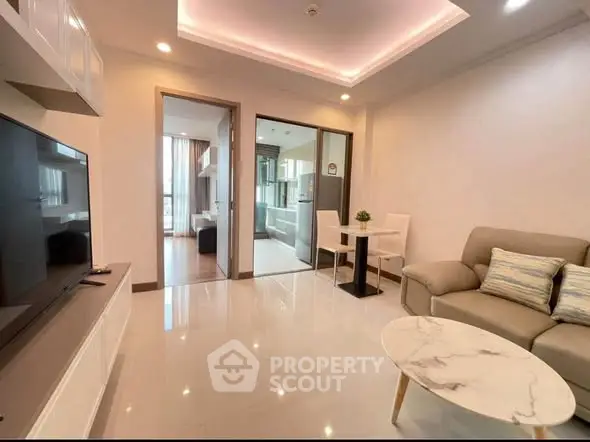 Modern living room with open layout and stylish furniture in a contemporary apartment.