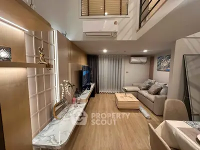 Modern living room with stylish decor, open layout, and cozy seating area in a contemporary apartment.