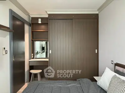 Modern bedroom with built-in wardrobe and cozy decor