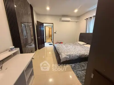 Spacious bedroom with modern decor and air conditioning