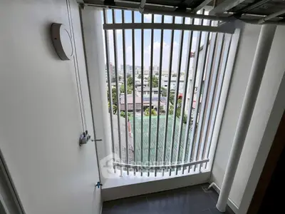 Charming balcony with city view, perfect for relaxation and enjoying the urban landscape.