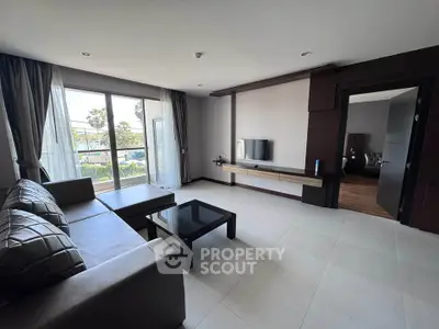 Spacious modern living room with large windows and stylish furniture