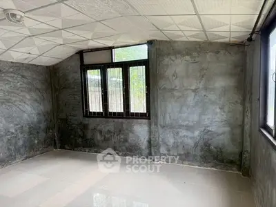 Spacious room with large windows and modern tiled flooring, perfect for customization.