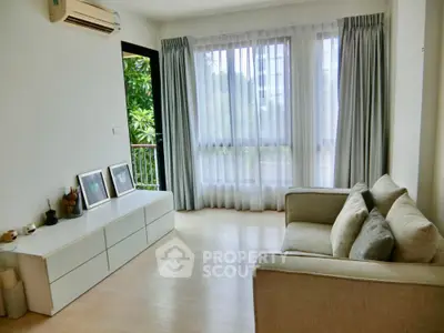 Bright and airy living room with large windows and modern decor