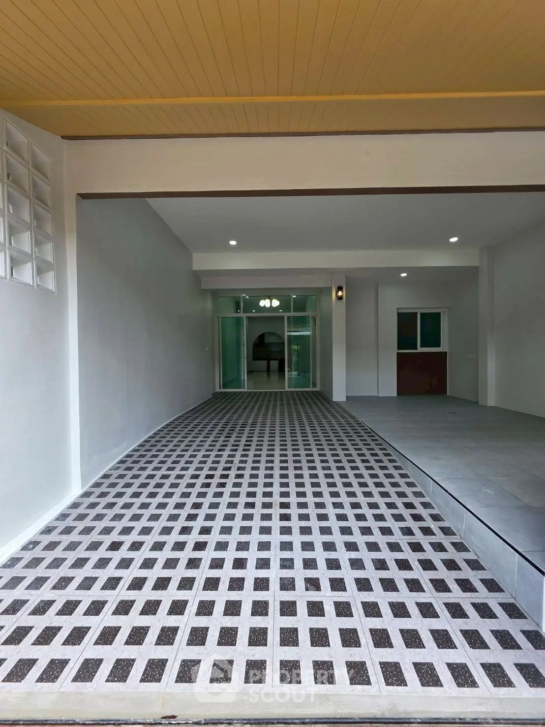 Modern building entrance with sleek design and ambient lighting