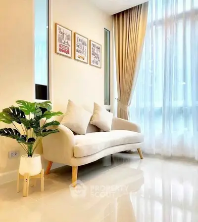 Elegant living room with modern sofa and large window drapes