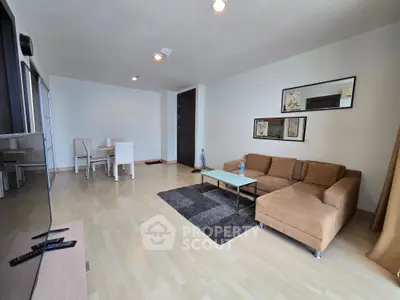 Spacious modern living room with stylish furniture and dining area, perfect for relaxation and entertainment.