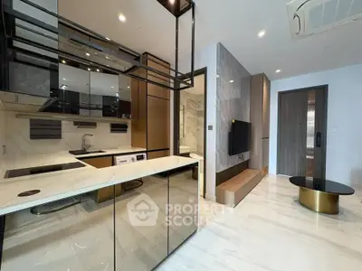 Modern open-layout kitchen with sleek design and integrated appliances in luxury apartment.