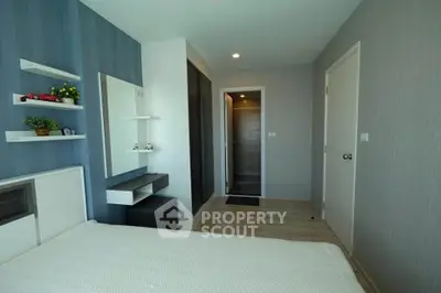 Modern bedroom with stylish decor and ample natural light