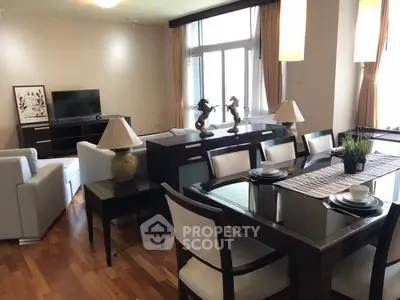 Spacious living and dining area with elegant decor and natural light