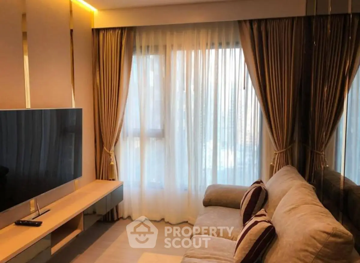 Cozy living room with elegant curtains and modern TV setup