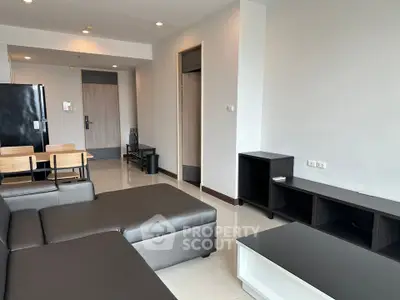 Modern living room with sleek furniture and open layout in a contemporary apartment.