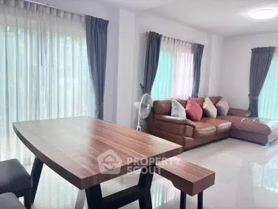 Spacious living room with modern furniture and natural light