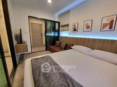 Modern bedroom with stylish decor and cozy ambiance in a contemporary apartment.