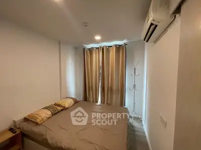 Cozy bedroom with air conditioning and natural light