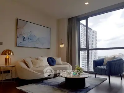 Modern living room with stylish furniture and large window offering city view.