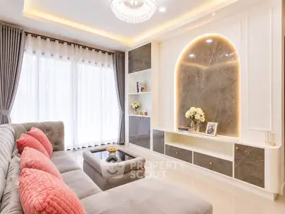 Luxurious living room with elegant decor, plush seating, and ambient lighting.