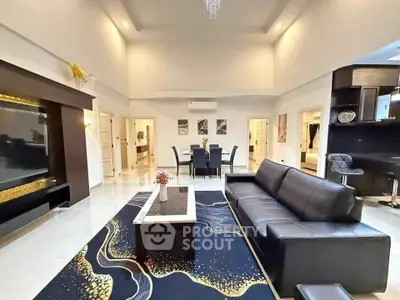 Spacious modern living room with elegant decor and high ceilings