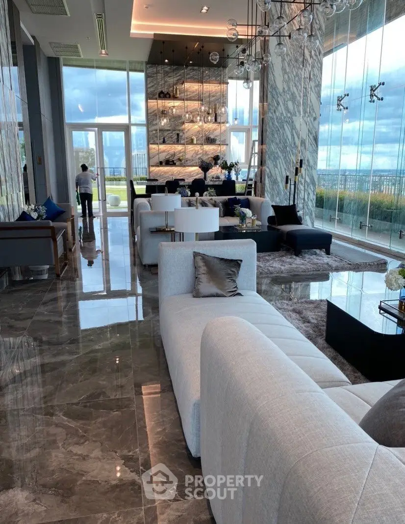 Luxurious modern living room with marble floors and panoramic city views.