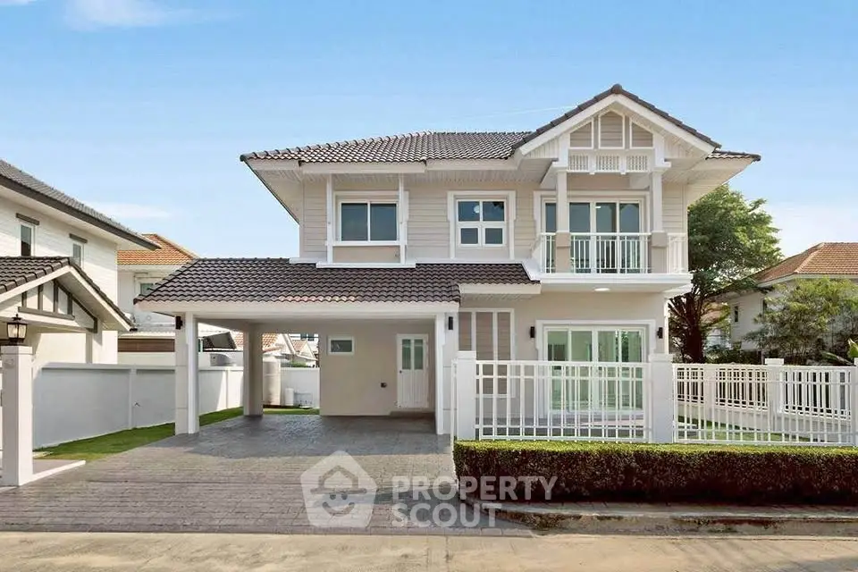 Charming two-story house with modern design and spacious driveway in a serene neighborhood.