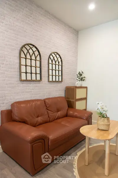 Cozy living room with leather sofa and stylish decor