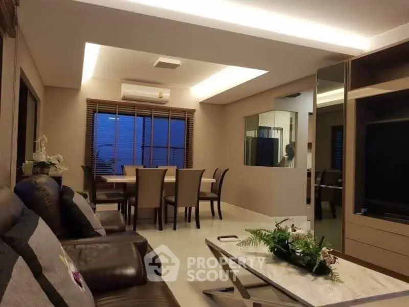 Spacious modern living room with elegant dining area and stylish decor