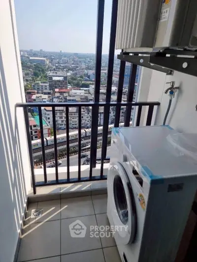 High-rise balcony with washing machine and stunning city view
