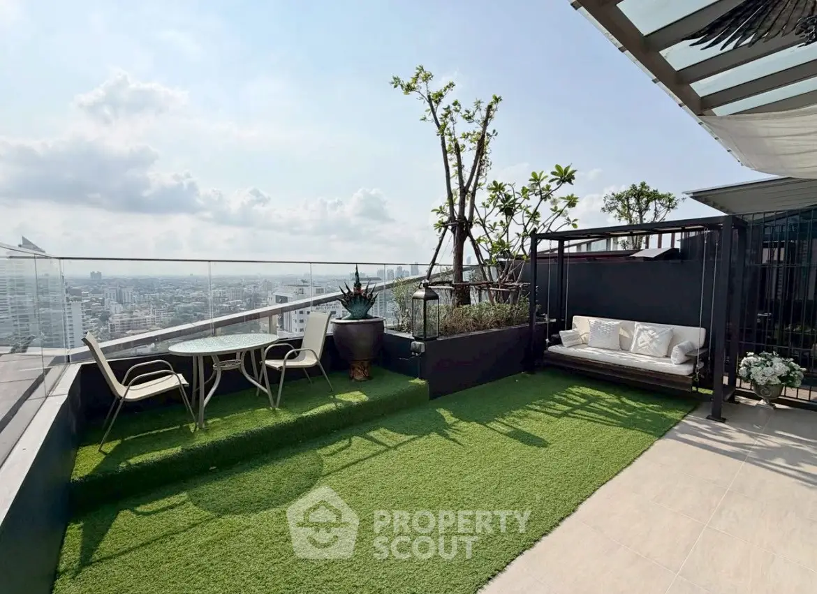 Luxurious rooftop terrace with stunning city views and cozy seating area.