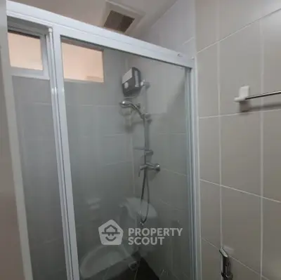 Compact bathroom with shower enclosure and modern fixtures