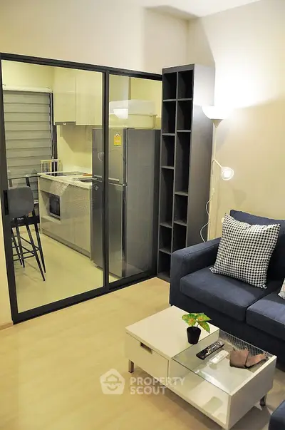 Modern living room with glass partition and cozy furniture