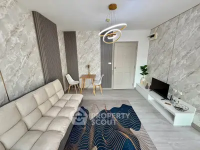 Modern living room with stylish decor, cozy sofa, and elegant lighting in a contemporary apartment.