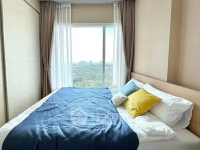Cozy bedroom with large window offering stunning cityscape view, modern decor and plush bedding.