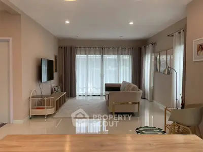 Spacious modern living room with elegant decor and natural light