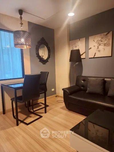 Chic modern living room with stylish decor and cozy seating in a contemporary apartment.