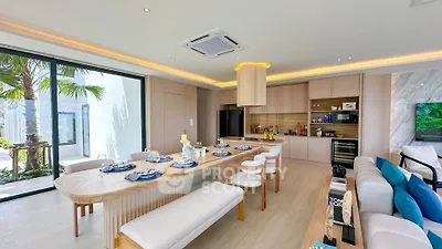 Luxurious open-plan living and dining area with modern kitchen and elegant decor