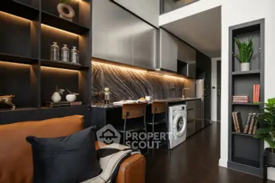 Modern kitchen with sleek cabinetry, integrated appliances, and stylish decor in a contemporary apartment.