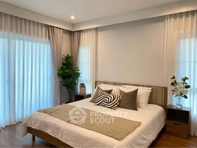 Elegant bedroom with cozy decor and natural light