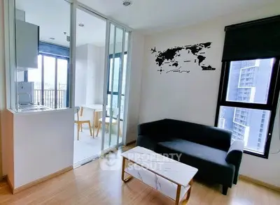 Modern living room with sleek furniture and city view, adjacent to a bright dining area.