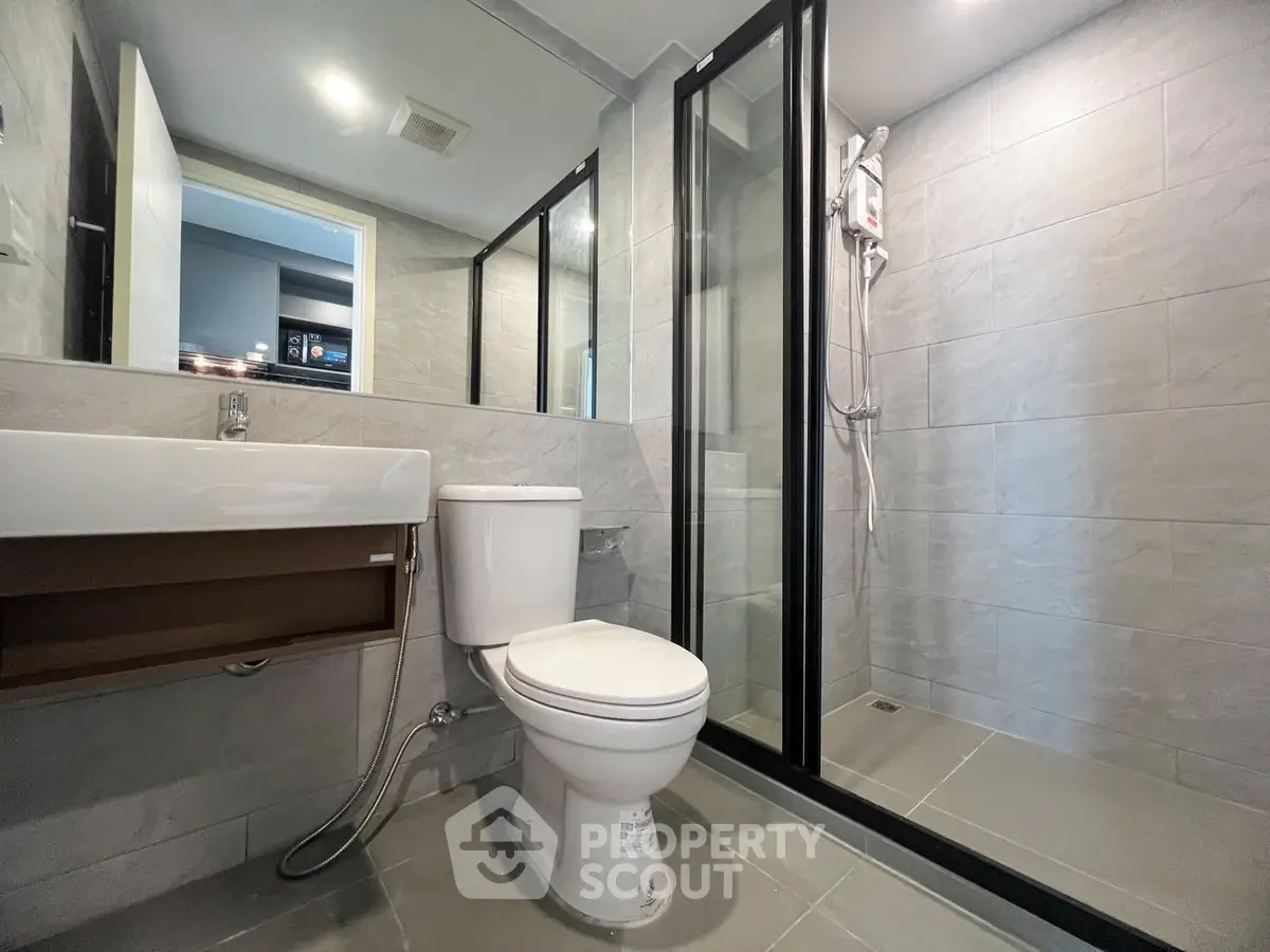 Modern bathroom with sleek design and glass shower enclosure