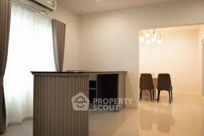 Modern interior with sleek dining area and stylish lighting