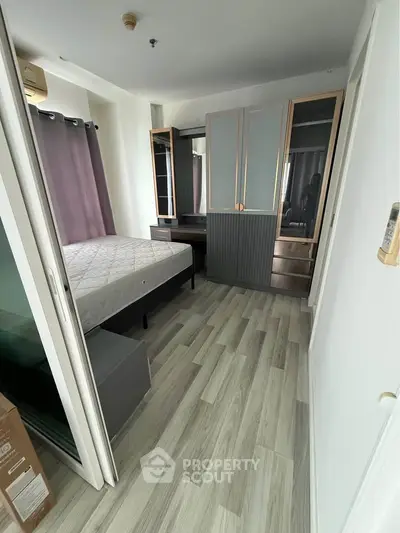 Modern bedroom with stylish wardrobe and natural light