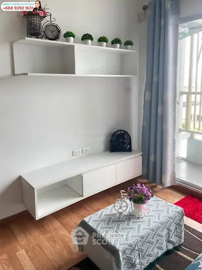 Charming living room with modern decor and balcony view in a stylish condo