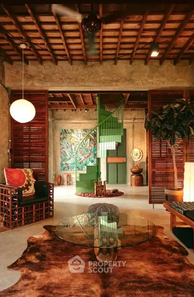 Stunning rustic living room with unique green spiral staircase and artistic decor